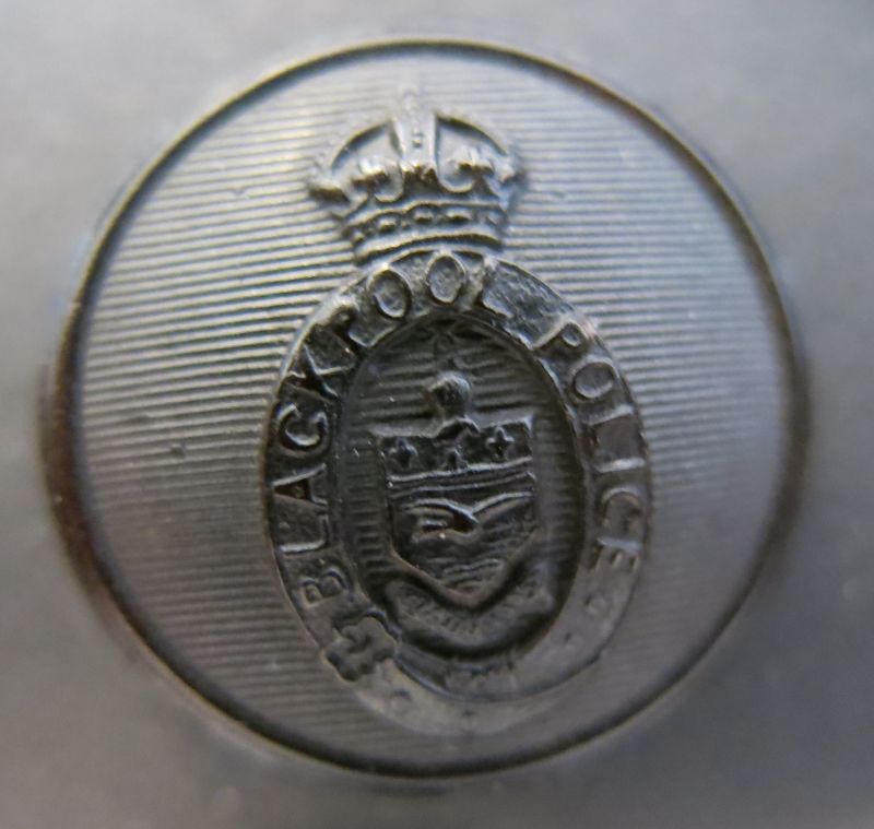 Greatcoat & Raincoat Button 
26mm Black horn button with Borough Arms and a Tudor or Kings Crown. Worn on great coats from mid 1920's to early 1950's on greatcoats and raincoats by all ranks.
Keywords: Greatcoat Raincoat Black Button King Crown Blackpool KC