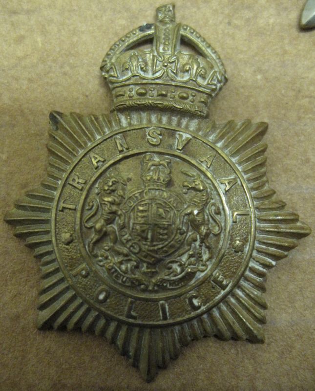 Cap Badge Transvaal Police
KC Gilding metal on two copper lugs worn by all non officer ranks between 1908 and 1913
Keywords: Transvaal Cap KC