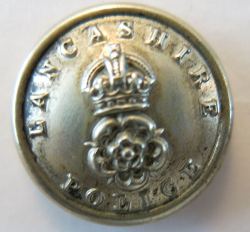 Lancashire Police KC White Metal Tunic Button 21 mm 
Worn in the period from the early 1900's through to when the buttons took on the official title Lancashire Constabulary the exact date of which I am not sure but probably some time around the First World War. This would have been worn on the tunic.
Keywords: Button KC White Metal Lancashire Police Tunic Button