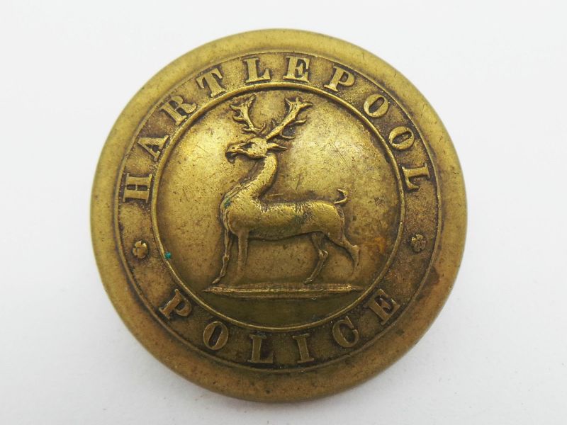 Tunic Button Brass Pre 1900's
Brass tunic button. Note there is just a Hart and no nog accompanying dog on the design (See helent plate for usual Hart design profile) 
Keywords: Hartlepool button brass