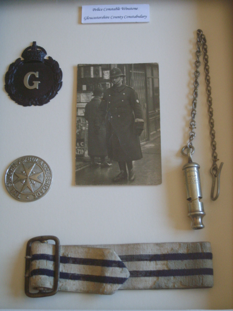 A Policeman's Lot!
Photograph of Pc Winstone, Gloucestershire County Constabulary, circa. 1925
Displayed with his whistle & chain, Helmet badge, St John Ambulance Brigade first aid qualification arm badge, and 'On Duty' armband (rare to see horizontal stripes).
Keywords: Gloucestershire Constabulary