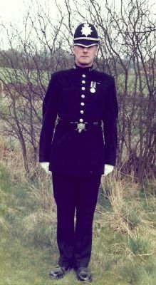 Pc "A" 116 Ronald Gore, Bristol Constabulary
In ceremonial uniform with Police Exemplary Long Service medal and Queens commendation for bravery (silver leaves brooch) to right of medal on tunic.
Keywords: Bristol Constabulary